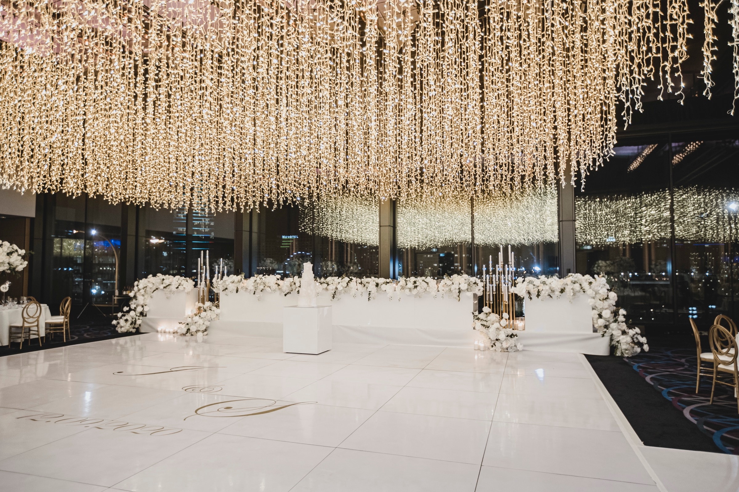 Professional ceiling lighting installation at a luxury Sydney event — Chandeliers to Die For